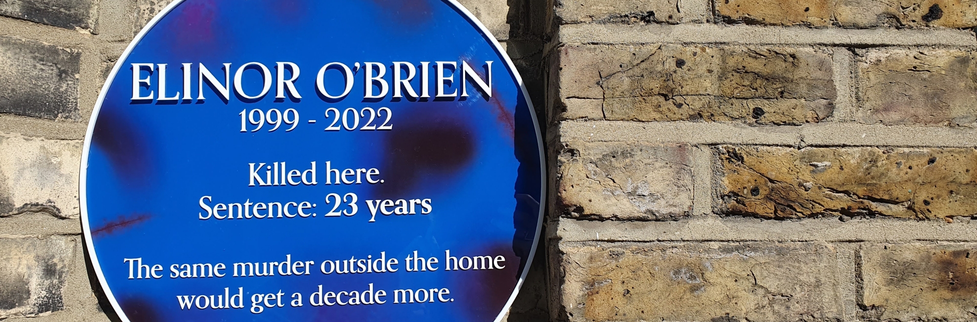 Black and blue plaques honour the memories of women killed in the home